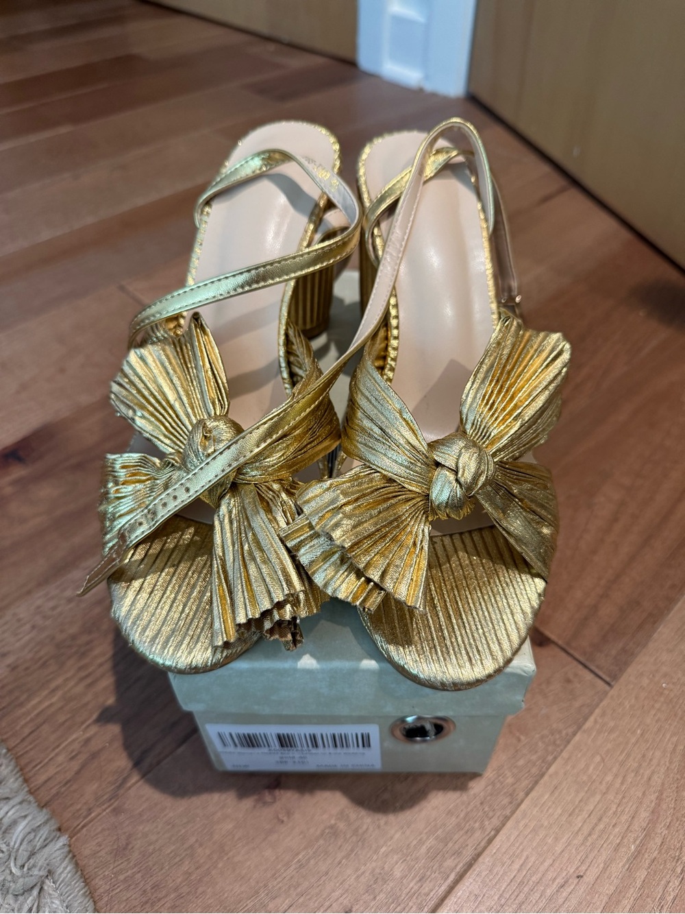 Gold strappy heels with bow